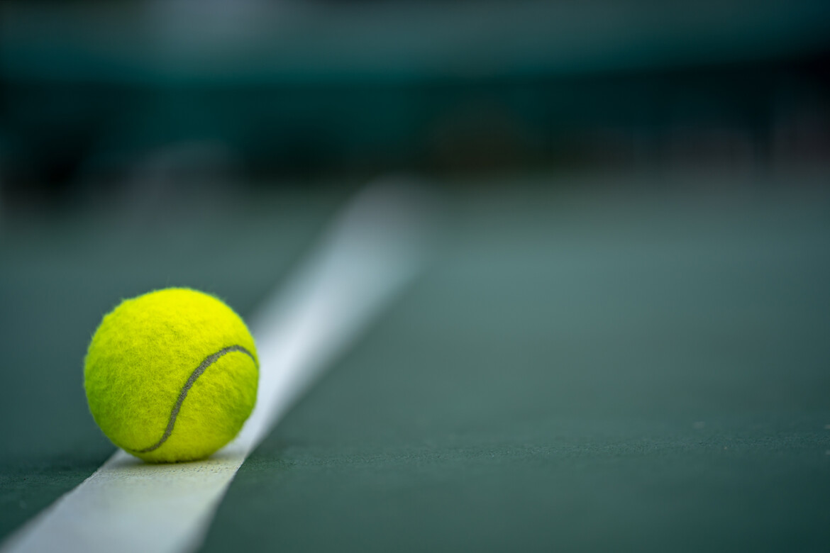 beginning-champion-close-up-tennis-ball-courts-background.jpg